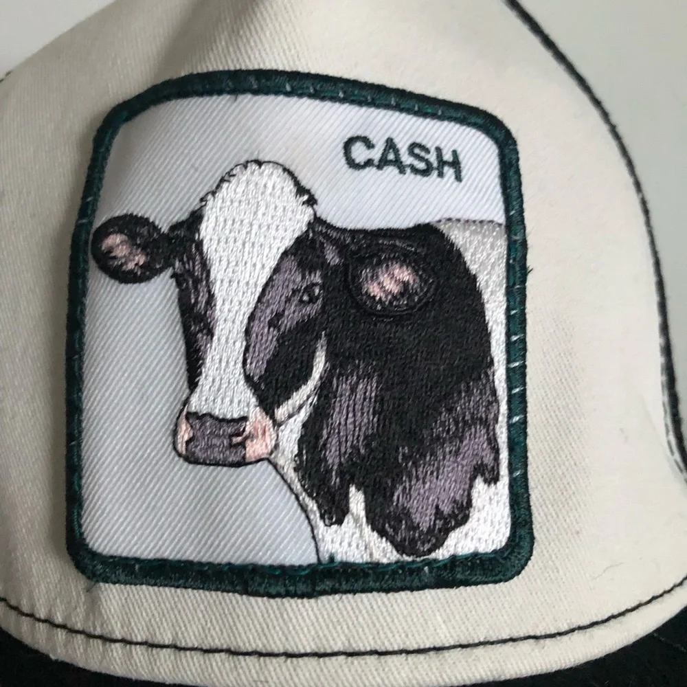 Cash Cow Black & White Cow Patch Trucker Hat